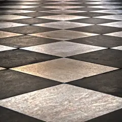 Un sol en damier noir et blanc, posé en diagonale, crée une perspective saisissante. L'avantage de cette pose de carrelage diagonale est son effet d'agrandissement visuel.