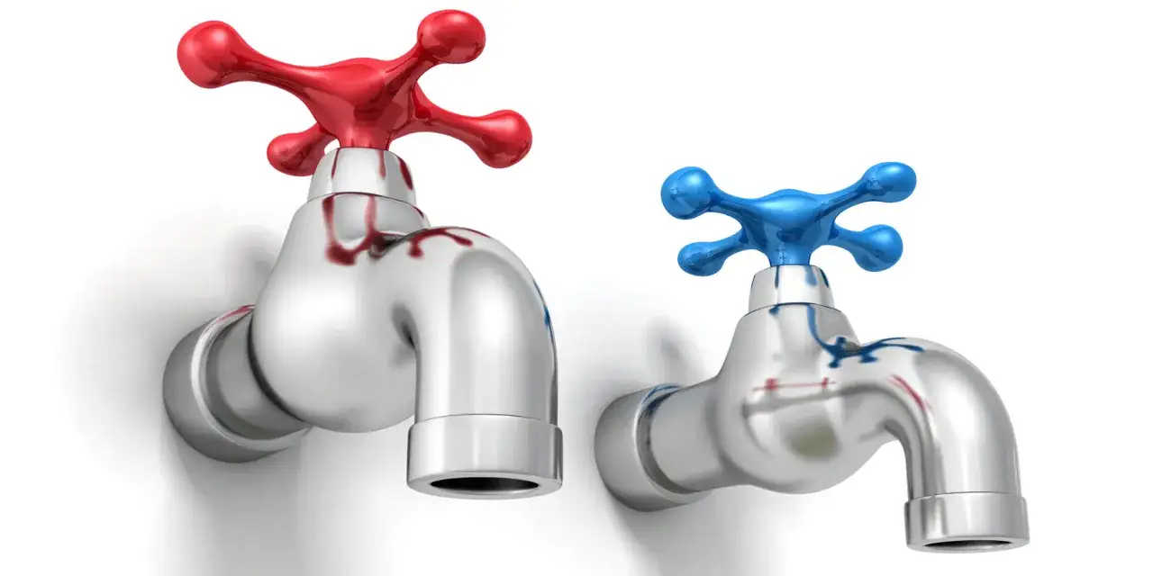 Deux robinets chromés, un rouge à gauche et un bleu à droite, symbolisant l'eau chaude gauche ou droite.